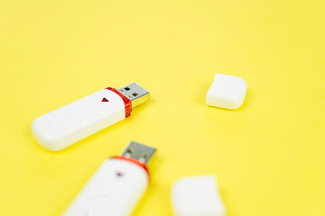 USB flash drive on a yellow background