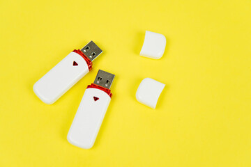 USB flash drive on a yellow background