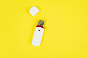 USB flash drive on a yellow background