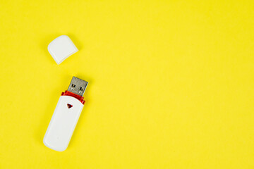 USB flash drive on a yellow background