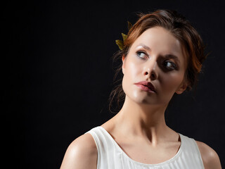 A beautiful ancient goddess from the era of the heroes of Hellas. A young woman in a white tunic...