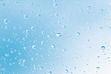 Drops at blue background . Transparent surface with raindrops