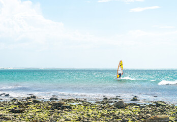 Man enjoying outdoor water sport on its wind sur boarding