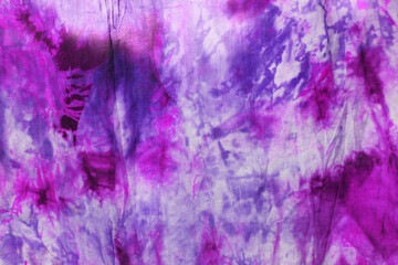 violet and purple Tie dye spiral shibori watercolor hand painted colorful ornamental elements on...