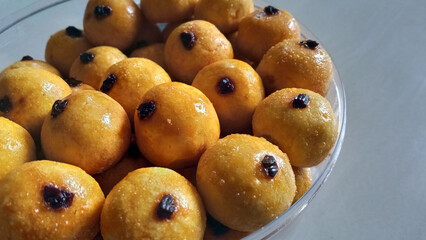 Close up view with open space of a bunch of Pineapple tart, also known as nastar, a small, bite-size tart filled with pineapple jam, commonly found throughout different parts of Southeast Asia