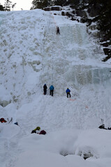 People climbing ice wall