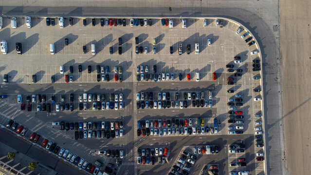 Aerial view of a shopping center parking lot. Drone photography of the vehicles in the parking lot.
