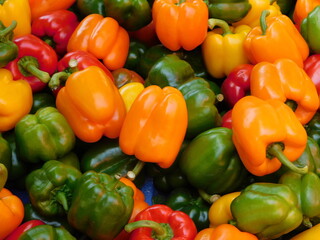Colorful peppers on display on a vegetable stand