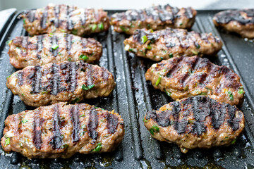 Juicy lamb meatballs on teflon barbecue grill