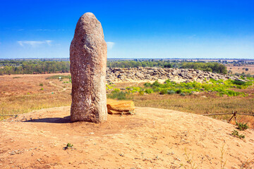 View of the ancient kurgan stela, stone idol against the backdrop of Kamyana Mohylain is an...
