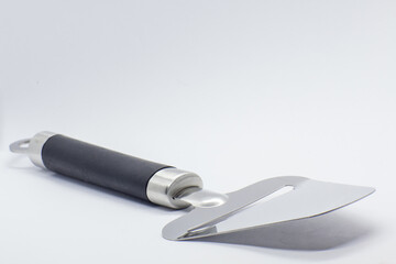 Close up photo of cheese slicer. Norwegian tradition and invention from norway.