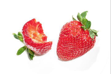 two ripe strawberries, one bite on white backgrund