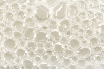 Soap bubbles background. Shampoo foam. Bubbles in the water