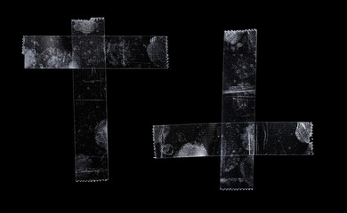 two sets of transparent sticky tapes overlapping each other on black background, crumpled plastic...