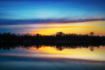 Fototapeta na wymiar Beautuful blue and yellow sunset on the Dnipro River