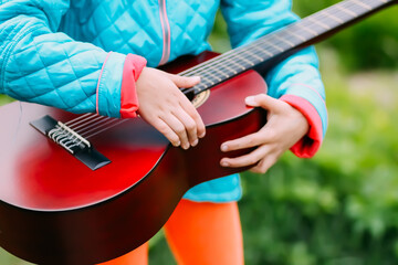 Fototapeta premium A guitar in child's hands 