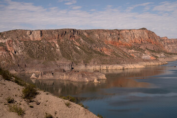 View of Cañón del Atuel in San Rafael, Mendoza. The colorful rocky formations, islets and lake in a sunny day.