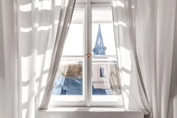 Rolgordijnen White wooden classic window with curtains and prague view © Tetiana
