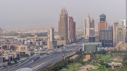 Naklejka na ściany i meble Aerial view of Sheikh Zayed Road in Dubai Internet City area timelapse
