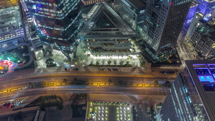 Obraz premium Office tower located in the Dubai International Financial Centre night timelapse