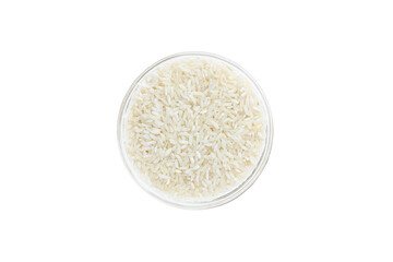 Rice groats in a glass bowl isolated on white background, top view. Healthy food.