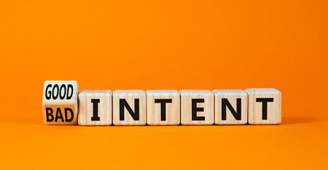 Good or bad intent symbol. Turned wooden cubes and changed concept words Bad intent to Good intent. Beautiful orange table orange background. Business bad or good intent concept. Copy space.
