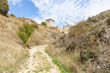 Fototapeta na wymiar a rural path going from the village to the medieval castle of Ucero, province of Soria, Castile and Leon, Spain