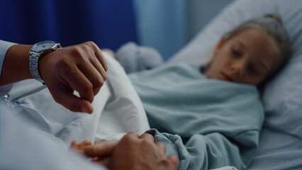 Obraz na płótnie Canvas Doctor hands checking pulse manually closeup. Medical examination in hospital.