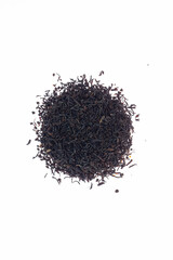 Dried black tea close-up isolated on white background with clipping path.
