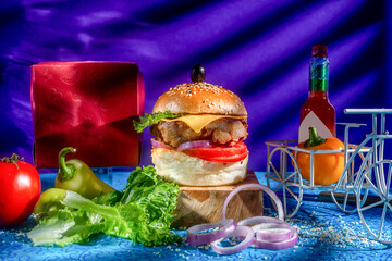 Chicken Cheese Burger with tomato, ketchup and green chilli isolated on wooden board side view of american fast food