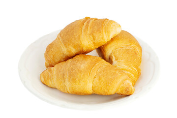 Three fresh mouth-watering croissants lie on a white plate on an insulated white background.