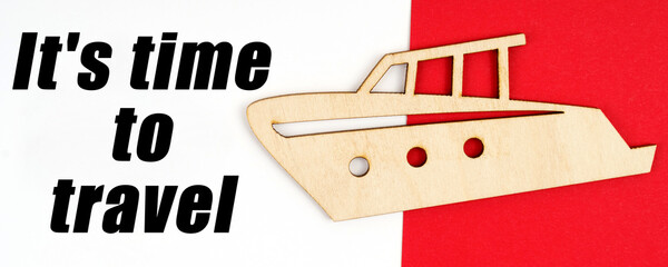 On a red and white background, a figure of a yacht and an inscription - It is time to travel