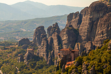Fototapeta na wymiar Mountain scenery with Meteora rocks and Monastery. Famous place in Greece