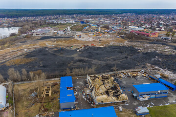 The aerial view of the destroyed and burnt buildings. The buildings were destroyed by russian...