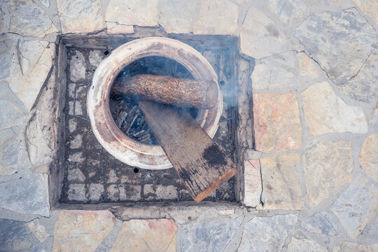 Top View Of A Fire Pit In Which Woods Are Burning.