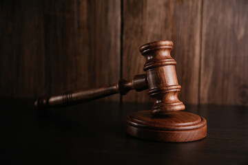 Judges gavel on wooden desk. Law firm concept