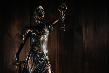 Lady Justice in a dark court room. Law concept