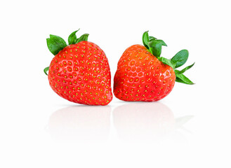 Two ripe strawberries isolated on white background. Fresh ripe strawberry close-up isolated on white background