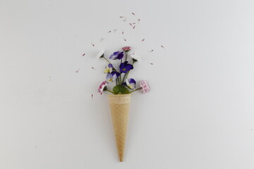 Bouquet of spring flowers in a waffle cone. Spring.