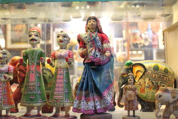 Fototapeta premium Indian traditional doll in saree with two other dolls