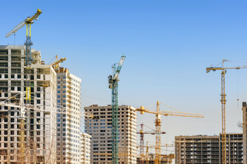 Fototapeta premium The process of building a residential area in a big city