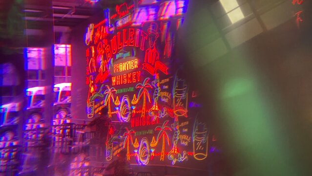 LOS ANGELES, CA, AUG 2021: abstract pattern created with prism viewing Bulleit Frontier Whiskey neon sign and nearby entrance at Grand Central Market in Downtown