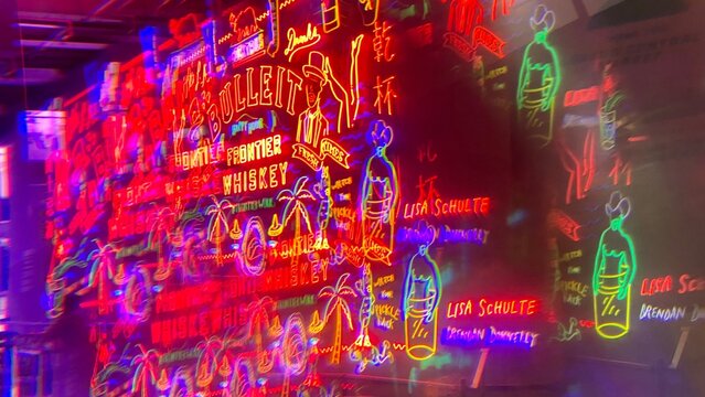 LOS ANGELES, CA, AUG 2021: abstract pattern created with prism viewing details of Bulleit Frontier Whiskey neon sign at Grand Central Market in Downtown