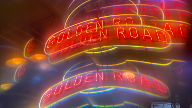 LOS ANGELES, CA, AUG 2021: abstract pattern created with prism viewing Golden Road Brewery's neon sign in Downtown at night.