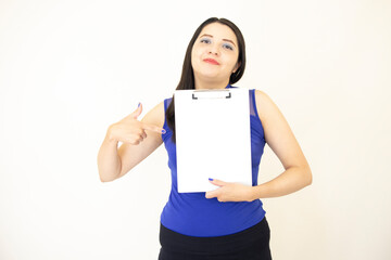 Naklejka premium Beautiful and successful CEO assistant, wearing blue blouse pleased demonstrating her progress, holding a chart with her hand, over white background