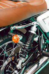 Fototapeta na wymiar Detail of the suspension on the rear wheel of a custom motorbike
