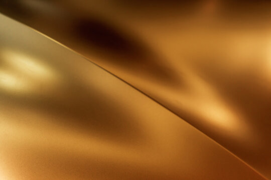 Gold or bronze matte metallic texture with a diagonal bend