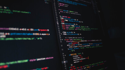 Background with a programming php html code on a dark screen