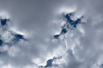 White cumulus clouds on a blue sky background. Nature background