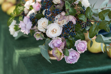 Beautiful flower wedding composition with roses on a table